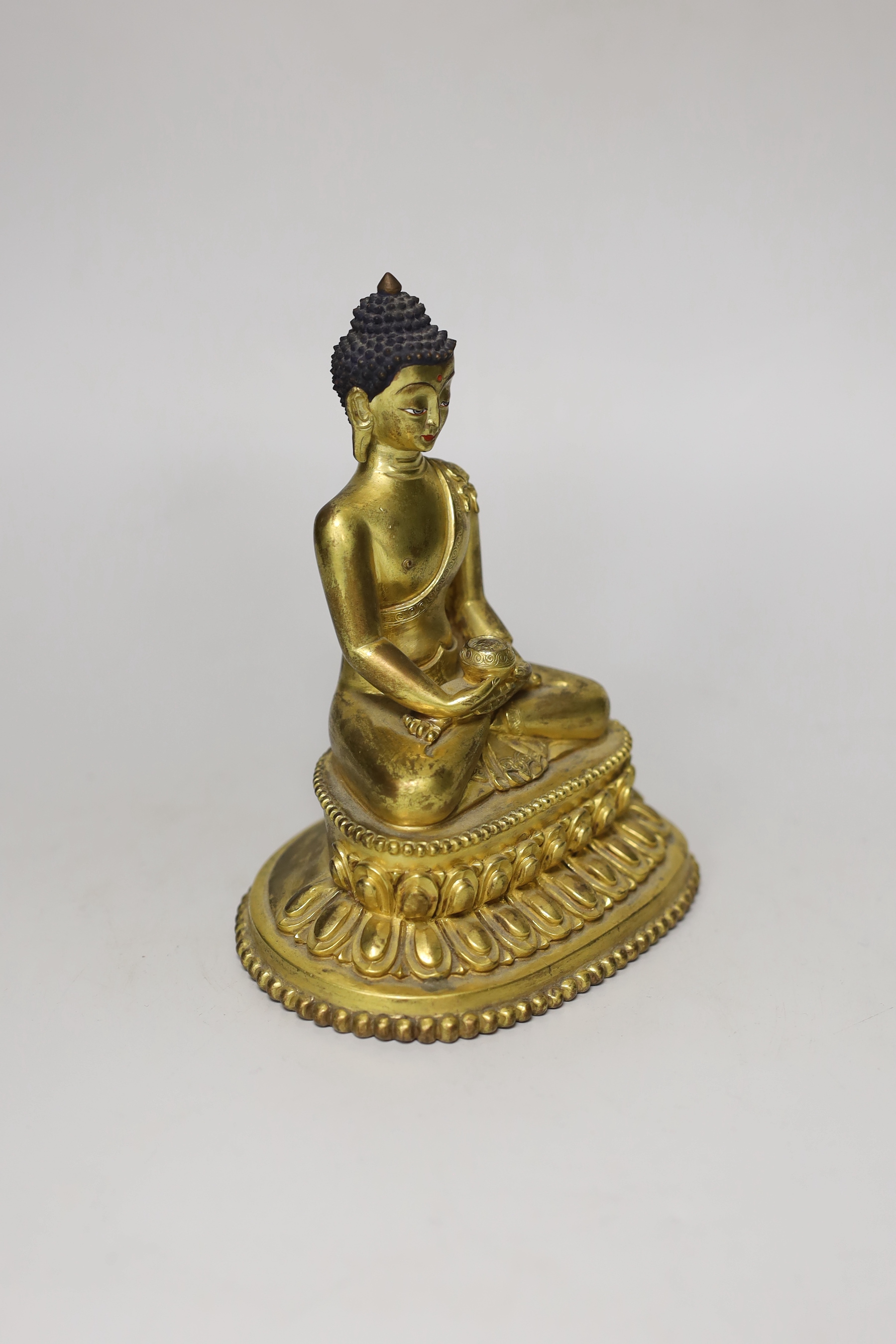 A Sino-Tibetan gilt bronze figure of Buddha Shakuamuni, 16cm